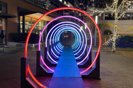 a looping spiral of rainbow light