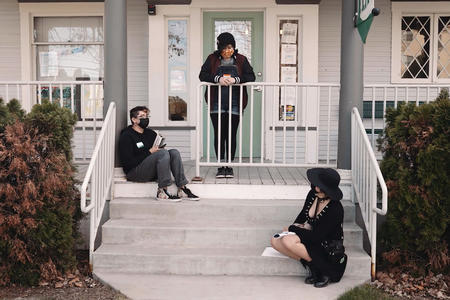 Youth drop-in visitors on the porch of The Space