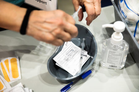 Vaccines being handled