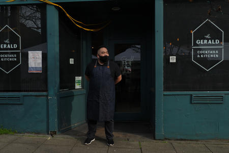 Wes Yoo standing in front of his restaurant
