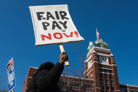 A protestor holds a sign outside Starbucks headquarters Wednesday 