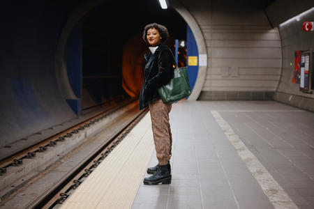 Jazmine Smith poses for a portrait at the Beacon Hill Light Rail Station