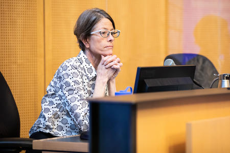 Seattle councilmember sara nelson sits behind the dais