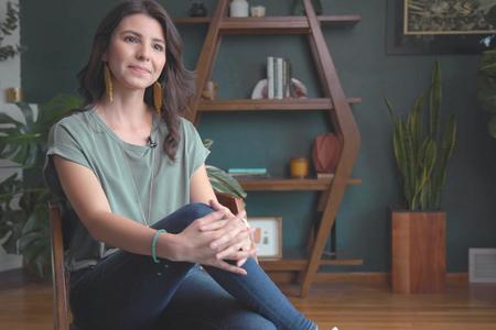 Printmaker Christie Tirado sits in the living room of her Yakima home.