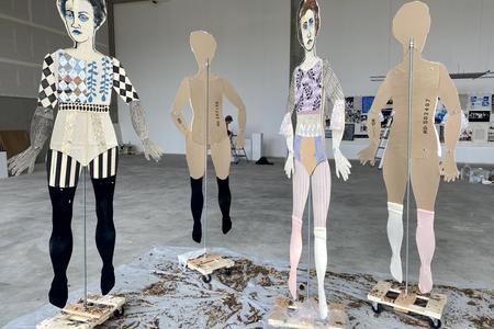 installation of 4 lifesize cardboard paper dolls