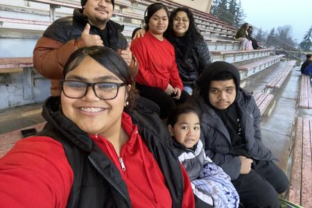 Athaliah P.S. Ioane and her immediate family pose for a group picture.