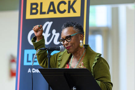 Vivian Phillips holding her fist up