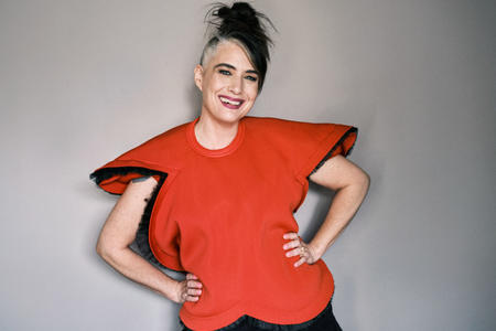 Kathleen Hana in a red top, smiling