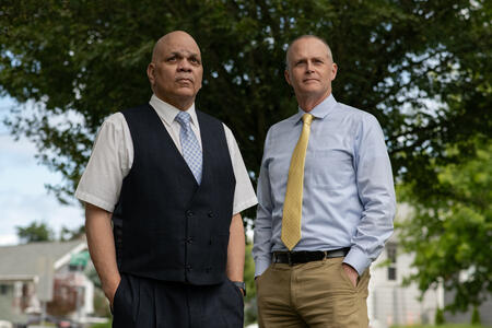 Cortez Hopkins and Doug Galuszka standing with their hands in their pockets
