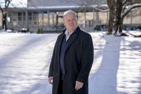 A person stands in the snow.