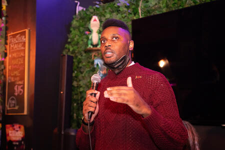 shaun scott speaks into a microphone 