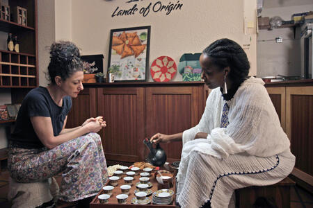 two women at an Ethiopian coffee ceremony