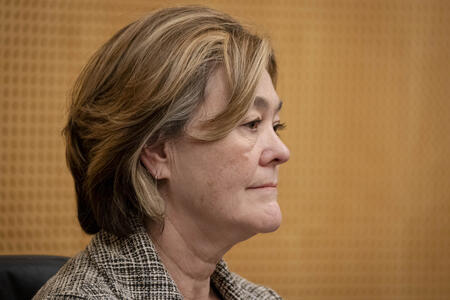 a close up of councilmember cathy moore, a white woman with blond hair wearing a gray blazer