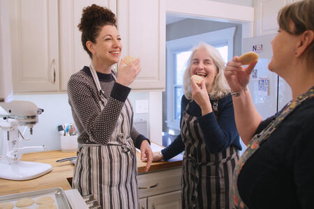 Rachel Belle, Jill Lightner, and Lanne Stauffer happily try a sweet cookie together