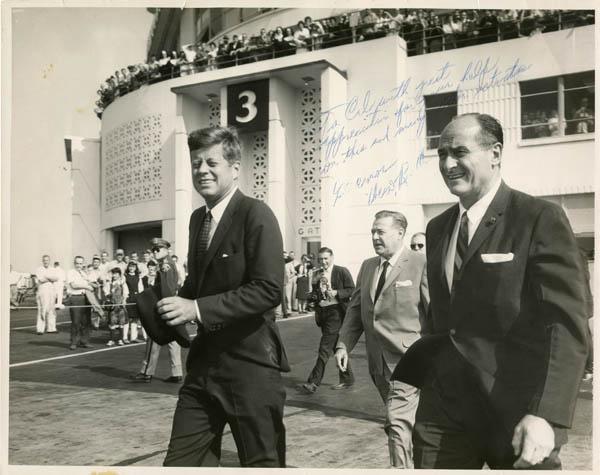 John F. Kennedy walks out of the SeaTac Airport