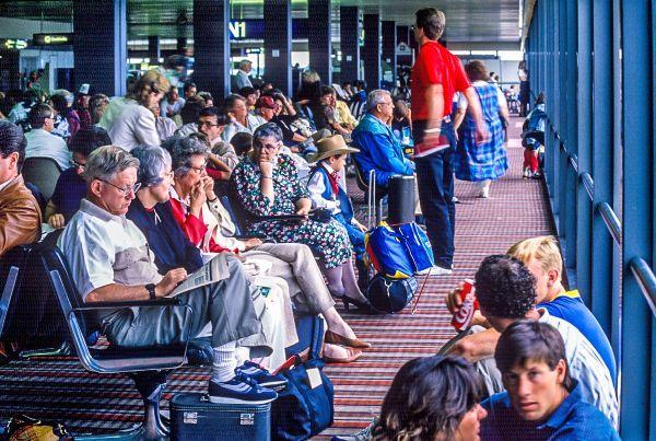 Passengers wait at a SEA Airport gate in 1992.